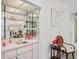 Wet bar with mirrored backsplash, shelving, and a small sink at 3275 Lori Ln # 5, New Port Richey, FL 34655