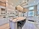 Gourmet kitchen featuring a large island and marble countertops at 4571 Lake In The Woods Dr, Spring Hill, FL 34607