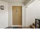 Beige front door with a doormat, leading into a condo unit at 3232 Lake Pine E Way # H2, Tarpon Springs, FL 34688