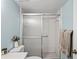 Clean bathroom with shower/tub combo, white tile, and updated vanity at 3232 Lake Pine E Way # H2, Tarpon Springs, FL 34688