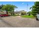 Community building with parking and American flag at 3232 Lake Pine E Way # H2, Tarpon Springs, FL 34688