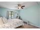 Spacious bedroom with a ceiling fan and calming decor at 3232 Lake Pine E Way # H2, Tarpon Springs, FL 34688