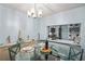 Bright dining area with a view of the kitchen and living room at 3232 Lake Pine E Way # H2, Tarpon Springs, FL 34688