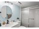 Clean bathroom with a large vanity and updated shower at 3232 Lake Pine E Way # H2, Tarpon Springs, FL 34688