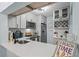 Bright kitchen with white cabinets, breakfast bar, and stainless steel appliances at 3232 Lake Pine E Way # H2, Tarpon Springs, FL 34688