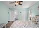 Serene bedroom with a queen-size bed and access to the bathroom at 3232 Lake Pine E Way # H2, Tarpon Springs, FL 34688