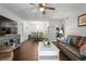 Living room with dark brown leather couch and a white coffee table at 3232 Lake Pine E Way # H2, Tarpon Springs, FL 34688
