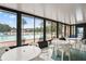 Relaxing pool area with patio furniture and lush views at 3232 Lake Pine E Way # H2, Tarpon Springs, FL 34688