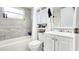 Clean bathroom with a white vanity and bathtub at 9114 Richwood Ln, Port Richey, FL 34668