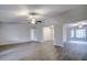 Open concept living area with neutral walls and wood-look floors at 1423 Meadow Lark Rd, Spring Hill, FL 34608