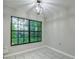 Bright dining room with large window and tile floors at 1423 Meadow Lark Rd, Spring Hill, FL 34608