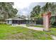 Spacious backyard with screened patio and pool at 1423 Meadow Lark Rd, Spring Hill, FL 34608