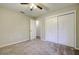 Cozy bedroom with ceiling fan and access to another room at 1423 Meadow Lark Rd, Spring Hill, FL 34608
