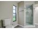 Modern bathroom with a glass shower and updated fixtures at 1423 Meadow Lark Rd, Spring Hill, FL 34608