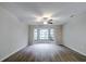 Spacious living room featuring a bay window and hardwood floors at 1423 Meadow Lark Rd, Spring Hill, FL 34608
