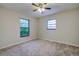 Bright bedroom with ceiling fan and neutral decor at 1423 Meadow Lark Rd, Spring Hill, FL 34608