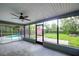 Bright screened porch with views of the backyard and pool at 1423 Meadow Lark Rd, Spring Hill, FL 34608