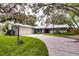 House exterior with driveway and landscaping at 1423 Meadow Lark Rd, Spring Hill, FL 34608