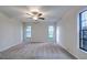 Spacious bedroom with neutral walls and carpet at 1423 Meadow Lark Rd, Spring Hill, FL 34608
