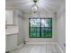 Bright breakfast nook with large window and tile floor at 1423 Meadow Lark Rd, Spring Hill, FL 34608