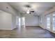 Bright living area with wood-look floors and a ceiling fan at 1423 Meadow Lark Rd, Spring Hill, FL 34608