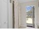 Bathroom with shower, vanity sink and access to the pool area at 6096 Kinlock Ave, Spring Hill, FL 34608