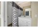 Bathroom with shower, vanity, sink, and mirror at 6096 Kinlock Ave, Spring Hill, FL 34608