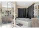 A bathroom featuring a large tub, walk in closet, and vanity sink at 6096 Kinlock Ave, Spring Hill, FL 34608