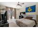 Bedroom featuring large window, ceiling fan, desk, and TV at 6096 Kinlock Ave, Spring Hill, FL 34608