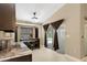 Eat-in kitchen area with granite counters, wood table and view of the pool area at 6096 Kinlock Ave, Spring Hill, FL 34608