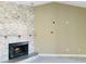Stone fireplace with mantle and tile floor in a room with beige walls at 6096 Kinlock Ave, Spring Hill, FL 34608