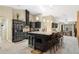 Modern kitchen features granite countertops, stainless steel appliances and a large kitchen island at 6096 Kinlock Ave, Spring Hill, FL 34608