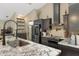 Granite countertops and stainless steel appliances highlight this modern kitchen design at 6096 Kinlock Ave, Spring Hill, FL 34608