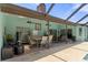 A large covered patio featuring an outdoor kitchen, dining area and seating at 6096 Kinlock Ave, Spring Hill, FL 34608