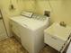 Laundry room with washer, dryer, and utility sink at 307 Killinger Ave, Spring Hill, FL 34606