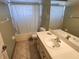 Bathroom with bathtub, sink, and shower at 307 Killinger Ave, Spring Hill, FL 34606