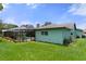 Side view of house with large backyard and pool at 6096 Kinlock Ave, Spring Hill, FL 34608