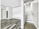 Spacious basement with wood-look flooring and a staircase at 4260 Columbus Dr, Hernando Beach, FL 34607