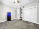 Bedroom with gray carpet, large closet, and aquarium at 4260 Columbus Dr, Hernando Beach, FL 34607