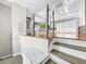 Open living space with hardwood floors and glass railing at 4260 Columbus Dr, Hernando Beach, FL 34607