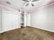 Spacious bedroom with double doors and built-in shelving at 4260 Columbus Dr, Hernando Beach, FL 34607