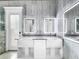 Elegant bathroom with double vanities and modern fixtures at 4260 Columbus Dr, Hernando Beach, FL 34607