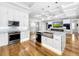 Updated kitchen with white cabinets, marble countertops and stainless steel appliances at 4260 Columbus Dr, Hernando Beach, FL 34607