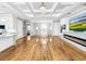 Spacious living room with hardwood floors, high ceilings, and a modern fireplace at 4260 Columbus Dr, Hernando Beach, FL 34607