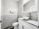 Clean bathroom, featuring a vessel sink and marble tile at 4260 Columbus Dr, Hernando Beach, FL 34607