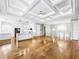 Open concept kitchen with white cabinets, marble countertops, and stainless steel appliances at 4260 Columbus Dr, Hernando Beach, FL 34607