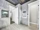 Large bathroom with tiled floors and multiple entrances at 4260 Columbus Dr, Hernando Beach, FL 34607