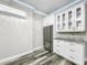 Modern kitchen with stainless steel appliances and white cabinets at 4260 Columbus Dr, Hernando Beach, FL 34607