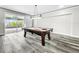Game room with pool table and sliding glass doors at 4260 Columbus Dr, Hernando Beach, FL 34607