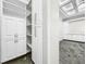 Bright white built-in shelving and cabinets at 4260 Columbus Dr, Hernando Beach, FL 34607